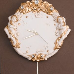 Orologio tondo da muro a pendolo con putti Via Veneto